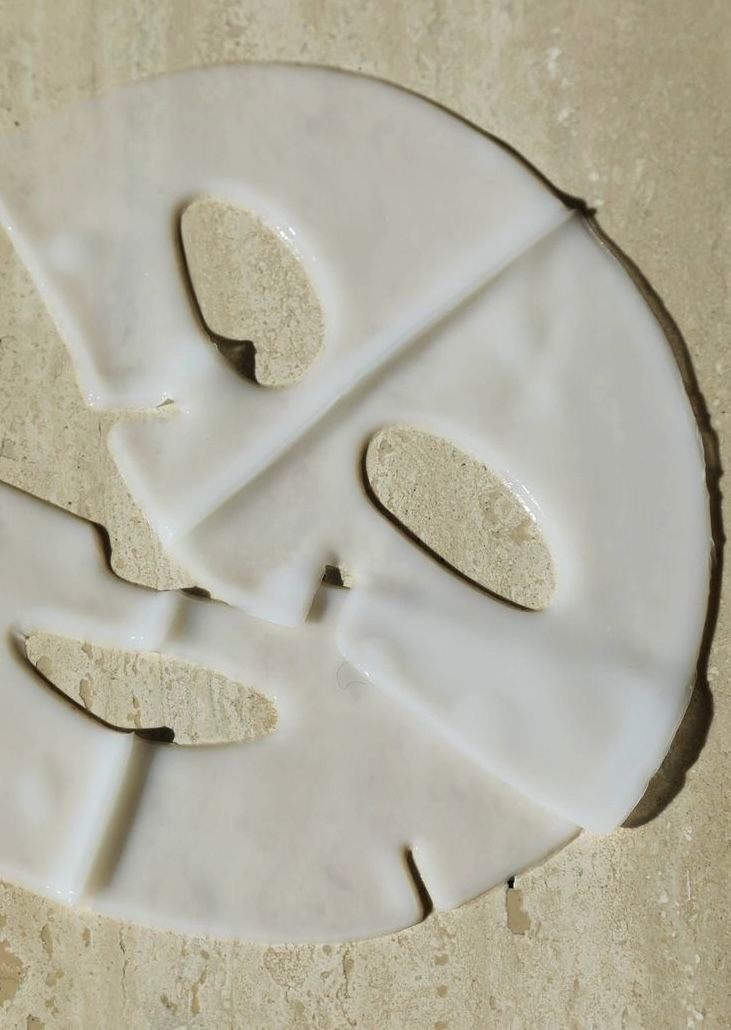 White ceramic plate with a decorative cutout design on a beige surface